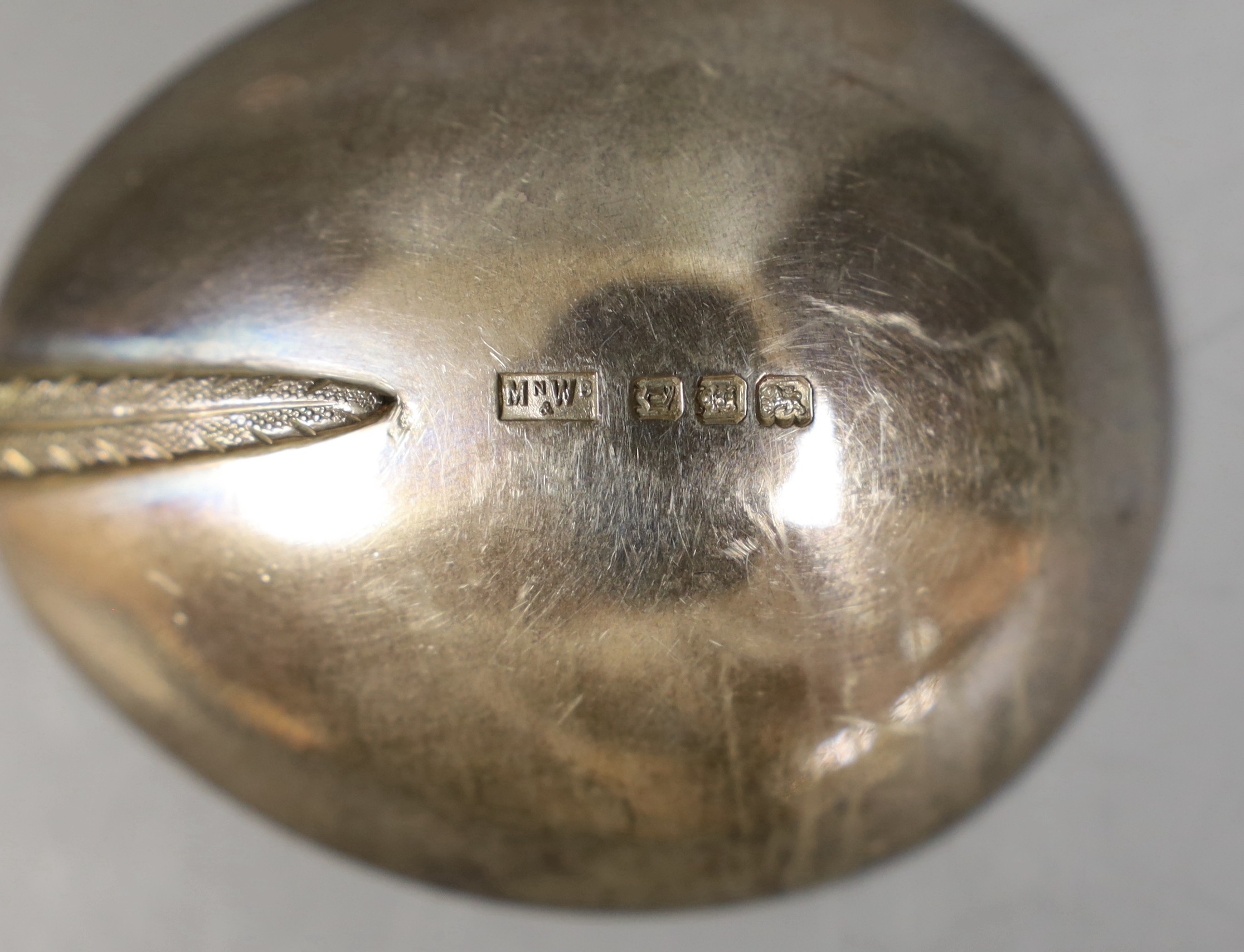 A pair of George V silver serving spoons, with ornate stems, Mappin & Webb, London, 1918/19, 19.6cm, 120 grams.